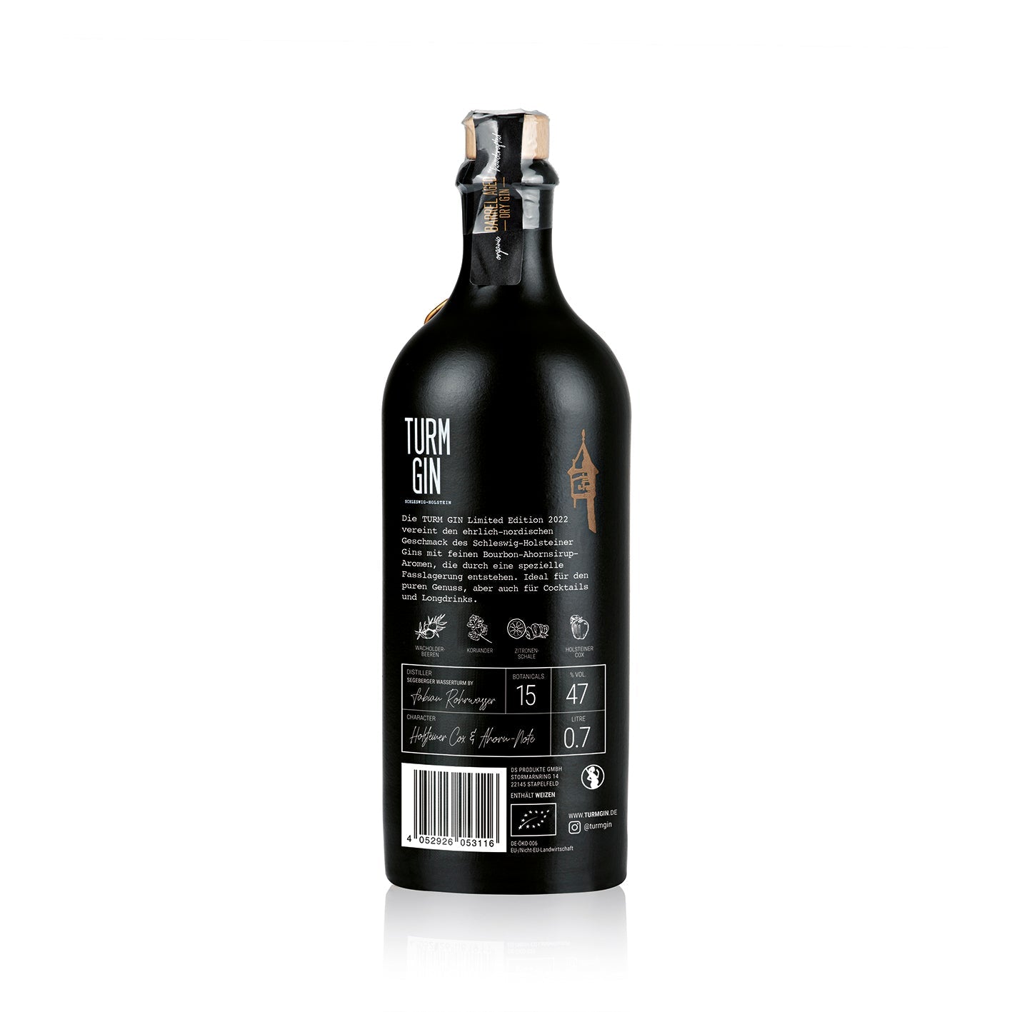 Rückseite der schwarze Flasche der TURM GIN Barrel Aged - Limited Edition 20223 mit Turmsiegel vor weißem Hintergrund.